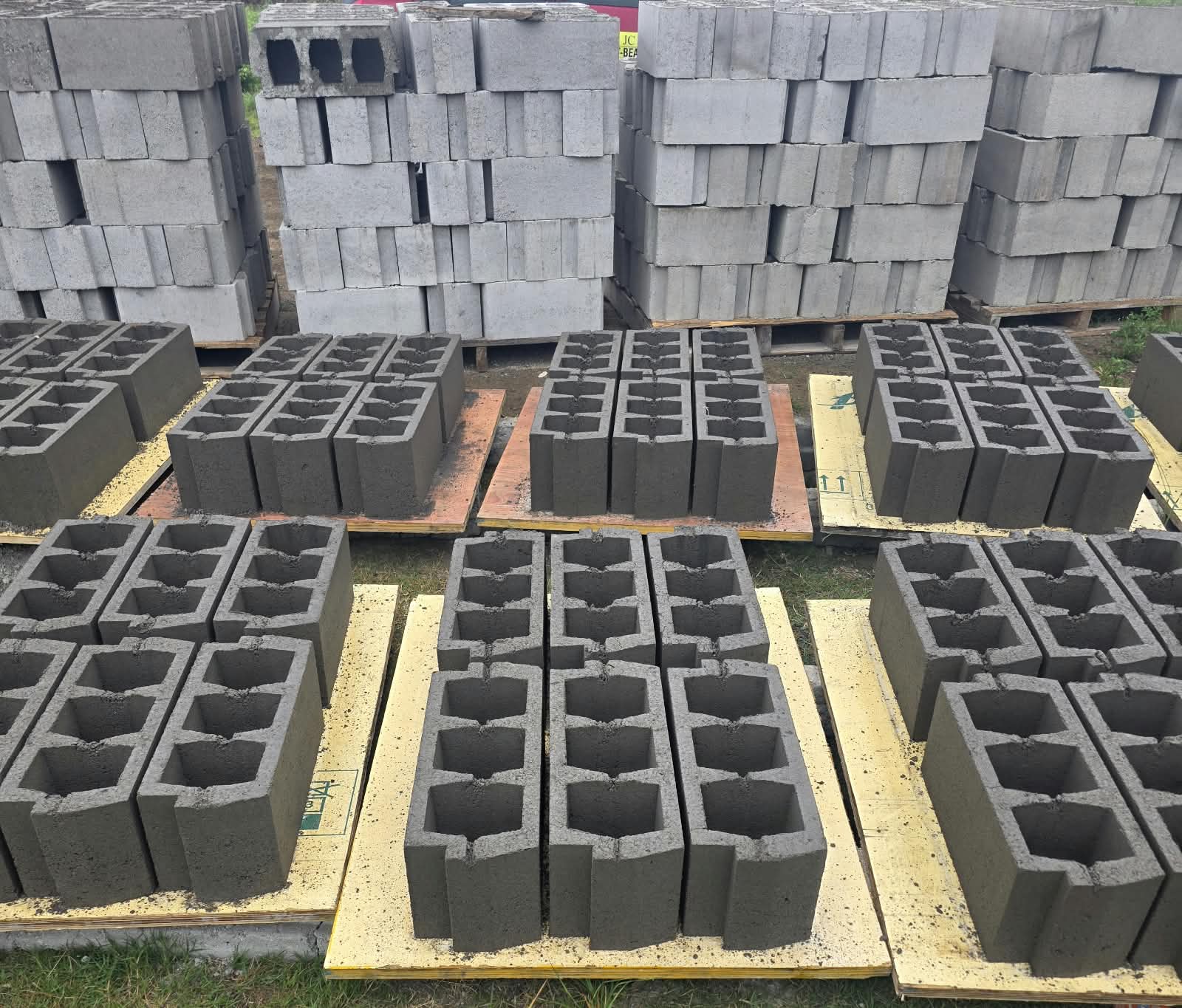 Cement blocks stacked on pallets at the JC Group yard